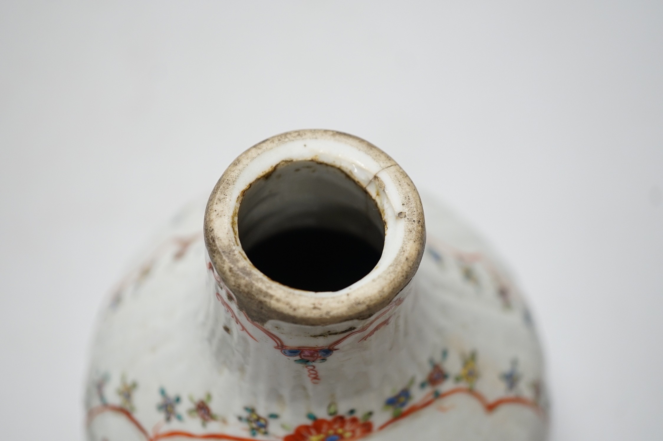 A Chinese Kangxi period clobbered bottle vase, reduced, height 29.5cm, and a Chinese plate, vase 18cms high